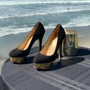 Charlotte Olympia “Dolly” Black/Gold Suede Pump.